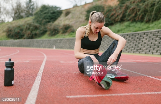 Oviedo, Asturias, Spain, athlete woman recovering after training